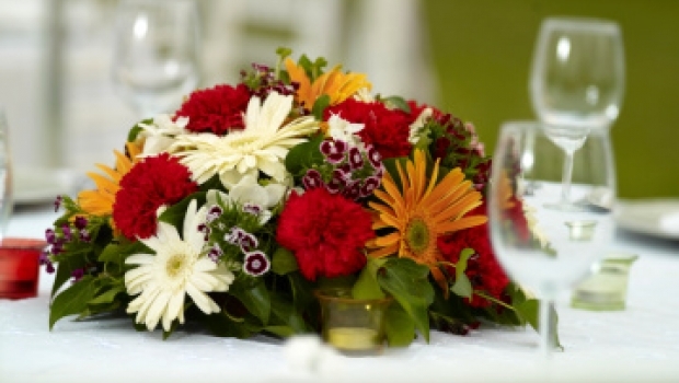 Decorate the table with fruit and flowers